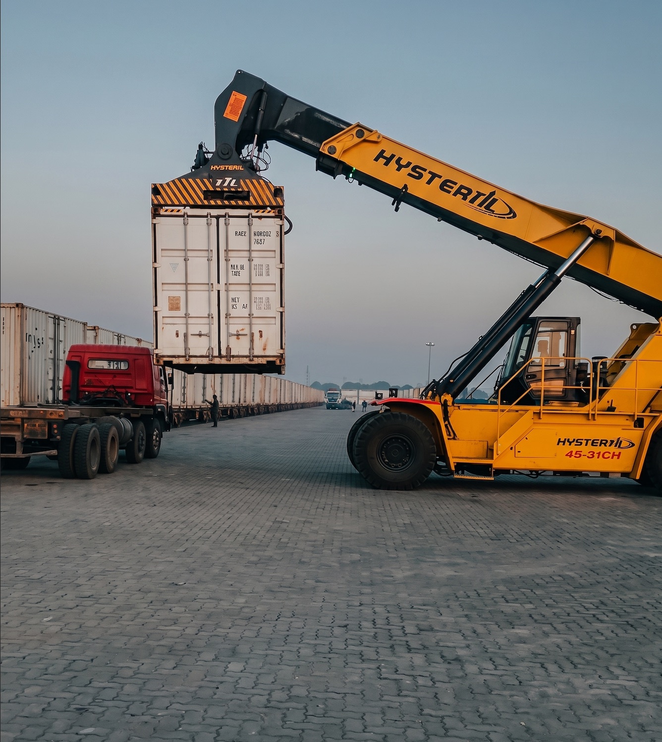 Reach stacker loading a container at an ICD freight terminal